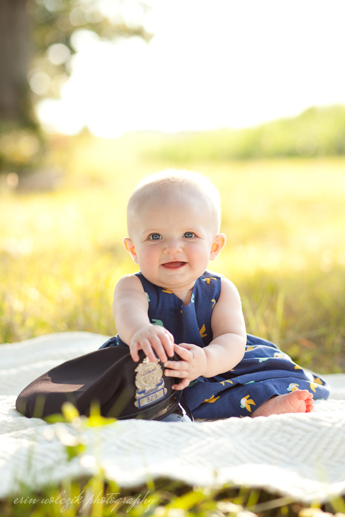 posing with dad's police hat . baby photographer ~ worcester, ma